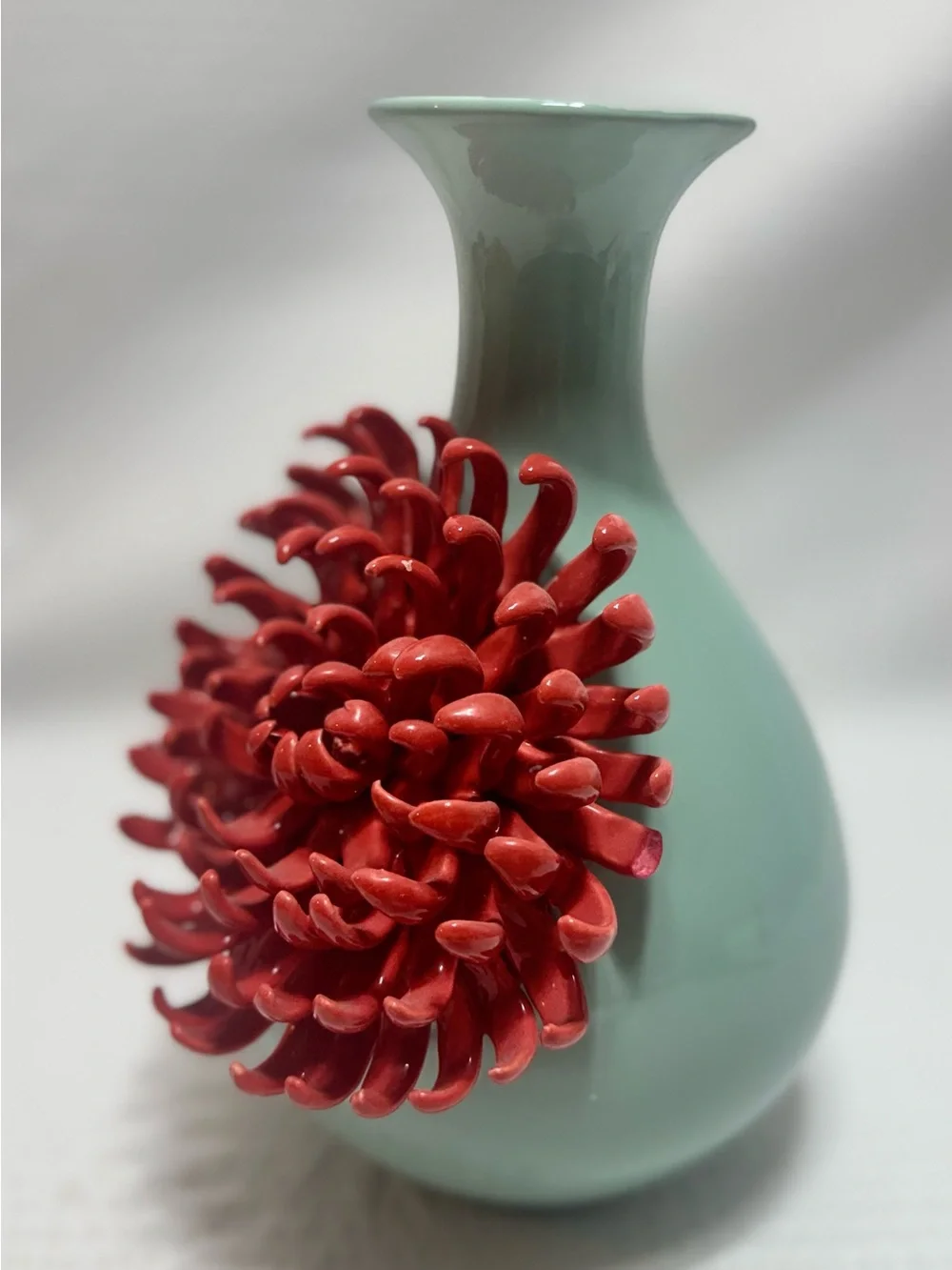 Anthropologie Ceramic Vase features a 3D red chrysanthemum bloom against a celad